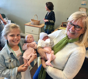 Linda Rotz Director having fun with babies