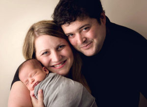 Adoptive parents Sarah and Colby with their precious newborn son, well worth the wait