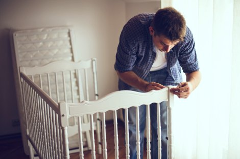 Future adoptive dad assembles the baby's crib, one of 7 productive things you can do during your adoption wait