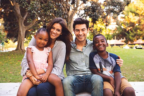 A happy family which was formed by transracial adoption
