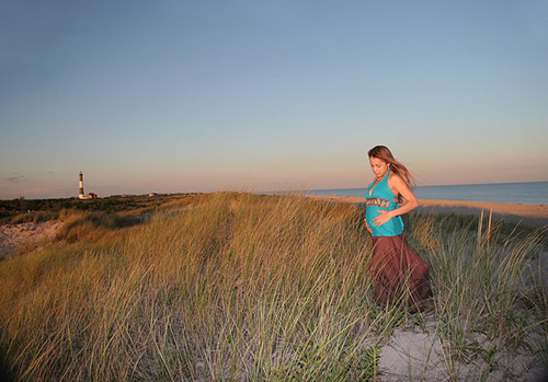 birth mom standing near ocean