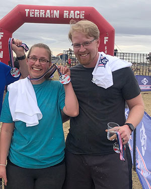 Adoptive couple Casey and Chris after finishing a race