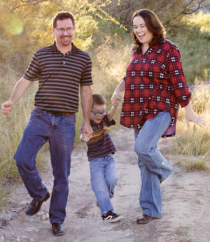 Dan and Karin on a hike with their son