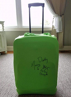 Photo of a suitcase with a cover, used for an adoption fundraiser