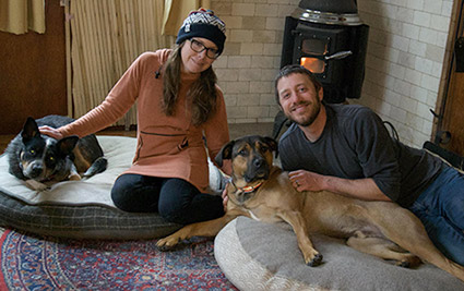 Jeremy and Kim relaxing at home with their dogs